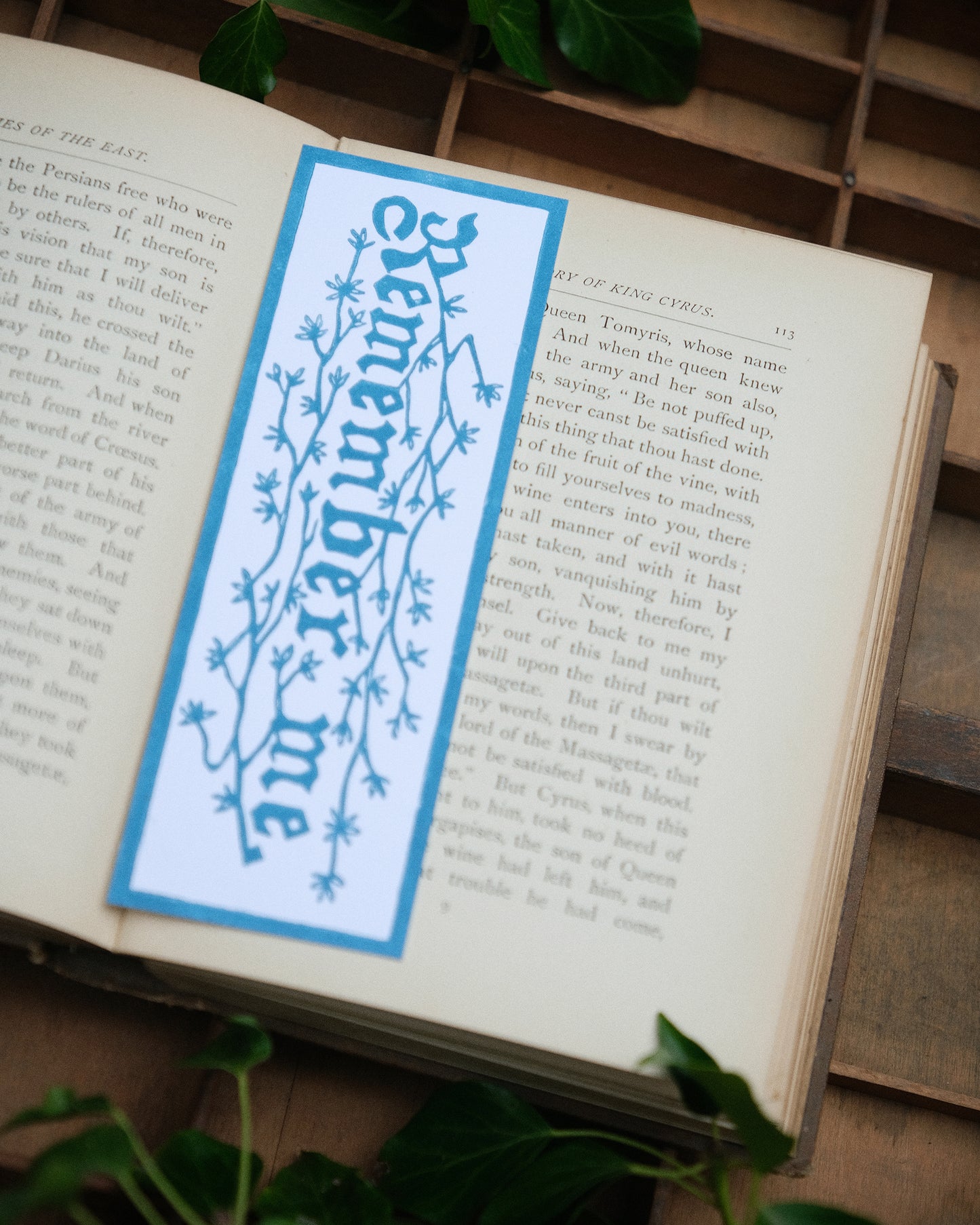 Book with a decorative vintage style bookmark on an open book